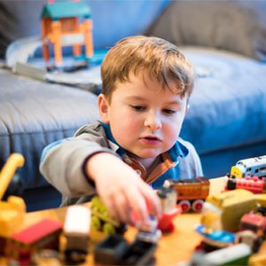 Children exploring learning materials at Tiny Tots Learning
